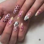 The nails feature a mix of solid white with dark red polka dots, beige and pink floral swirls, and a small 3D white bunny with black ears on one nail.